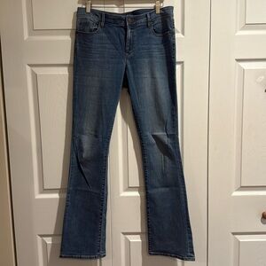 Loft Modern bootcut jeans, stretchy, 92% cotton, 7% polyester, 1% spandex.